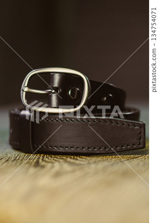 This Elegant Brown Leather Belt featuring a Classic Silver Buckle is an ideal accessory that complements and enhances any outfit, adding a touch of sophistication and style to your look This Elegant Brown Leather Belt featuring a Classic Silver Buckle is an ideal accessory that complements and enhances any outfit, adding a touch of sophistication and style to your look 134754071