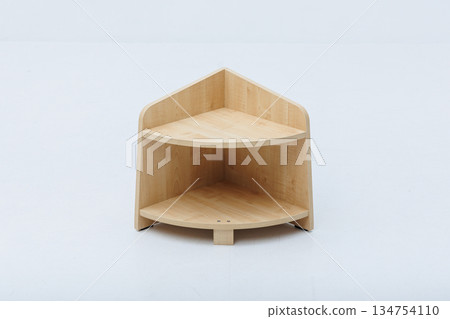 A small wooden corner shelf featuring two practical shelves A small wooden corner shelf featuring two practical shelves 134754110