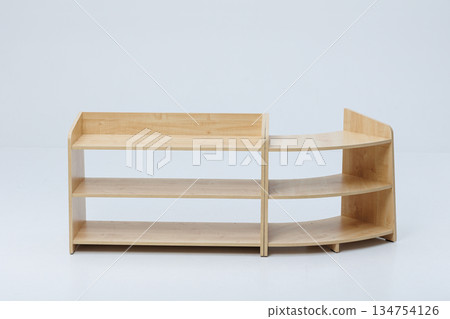 Wooden shelves beautifully arranged against a white background Wooden shelves beautifully arranged against a white background 134754126