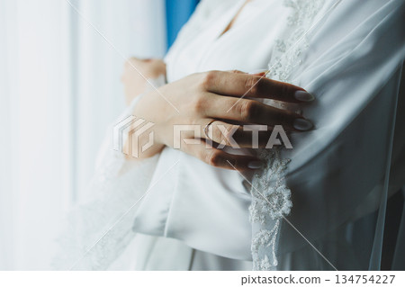 An Elegant Bride Bathed in Soft Light Surrounded by Delicate, Ethereal Fabric Accents 134754227