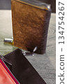 An assortment of Elegant Leather Wallets beautifuly Displayed on a Wooden Table A CloseUp Showcase of Stylish Accessories that combine both form and function for the modern individual 134754267