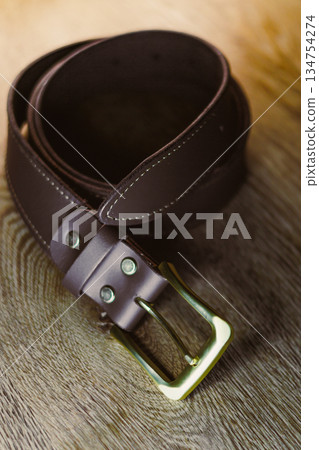 Introducing a Stylish Brown Leather Belt featuring a sturdy Brass Buckle, an ideal accessory that complements any outfit, whether for casual wear or more formal occasions, enhancing your overall look Introducing a Stylish Brown Leather Belt featuring a sturdy Brass Buckle, an ideal accessory that complements any outfit, whether for casual wear or more formal occasions, enhancing your overall look 134754274