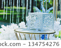 Beautiful and Elegant Wedding Decor Featuring Toasting Glasses and Lovely White Flowers 134754276
