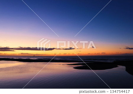 The lagoon and sea before dawn: A seascape enveloped in tranquility during the blue hour 134754417