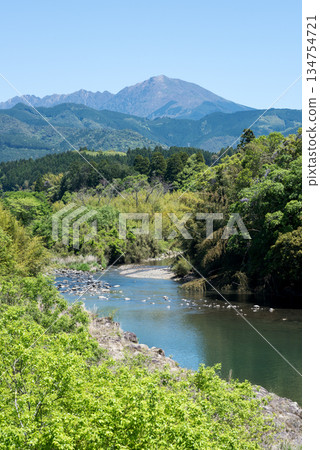 The flow of the Kuma River with Mt. Ichifusa in the background The flow of the Kuma River with Mt. Ichifusa in the background 134754721