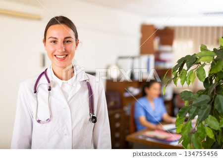 Portrait of woman doctor standing in office 134755456