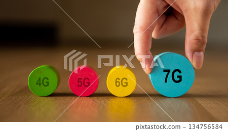 Hand placing 7g block showing communication technology progress 134756584