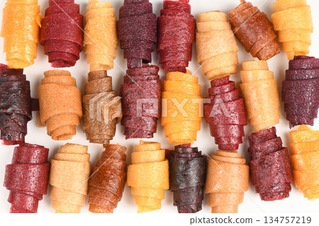 Large Background Pattern of Assorted Fruit Leather Rolls Large Background Pattern of Assorted Fruit Leather Rolls 134757219