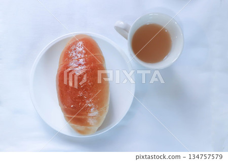 Shio Pan, Salzstangerl bread or Austria bread or Japanese bread and hot tea Shio Pan, Salzstangerl bread or Austria bread or Japanese bread and hot tea 134757579