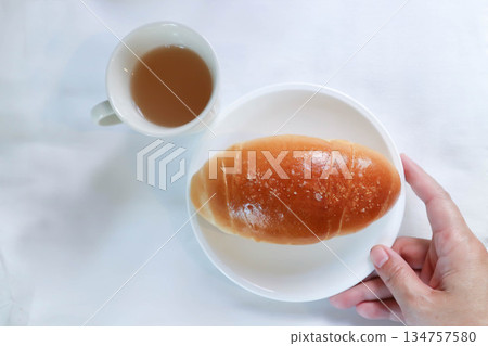Shio Pan, Salzstangerl bread or Austria bread or Japanese bread and hot tea Shio Pan, Salzstangerl bread or Austria bread or Japanese bread and hot tea 134757580