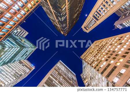 Tokyo's urban landscape in Japan is shining brightly into the future. The Otemachi office district is shining brightly despite it being the end of the work year. Towards a new era = December 26th 134757771