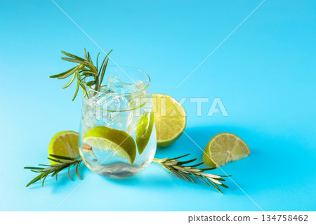 Summer refreshing drink with ice, lime and rosemary. Summer refreshing drink with ice, lime and rosemary. 134758462