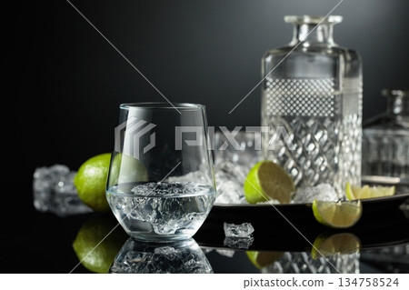 Vodka in a glass with ice. Vodka in a glass with ice. 134758524