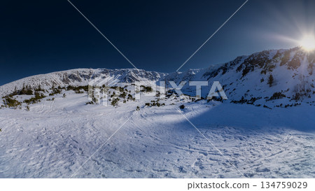 Winter mountain panorama with sun star in Low Tatras, Slovakia. 134759029