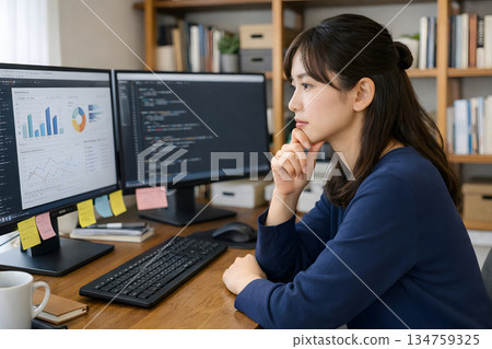 A woman concentrating on professional work at home 134759325