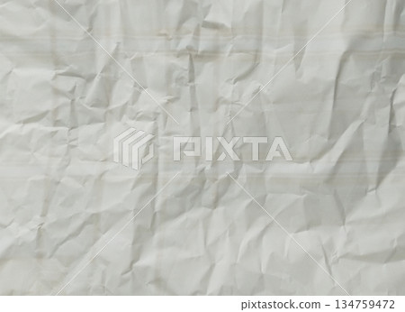 Abstract texture of crumpled paper. The paper exhibits numerous folds, wrinkles, and shadows Abstract texture of crumpled paper. The paper exhibits numerous folds, wrinkles, and shadows 134759472