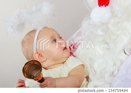 Little baby in christmas clothes and aureole Little baby in christmas clothes and aureole 134759484