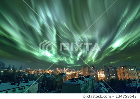 Aurora-like phenomenon illuminates city skyline with vibrant lights against a darkening twilight backdrop Aurora-like phenomenon illuminates city skyline with vibrant lights against a darkening twilight backdrop 134759542