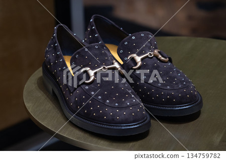 Elegant black suede loafers with tiny studs. Perfect for fashion shoots, luxury footwear displays, or chic everyday wear and styling ideas 134759782