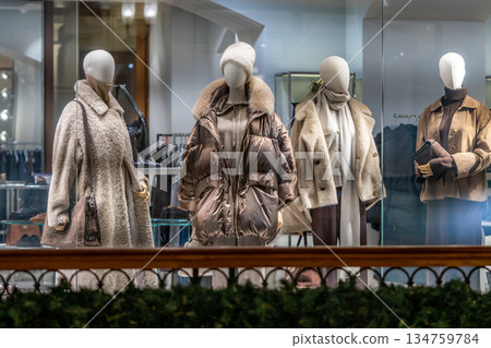 Winter Fashion Display Of Cozy Coats And Accessories In A Boutique Window Winter Fashion Display Of Cozy Coats And Accessories In A Boutique Window 134759784