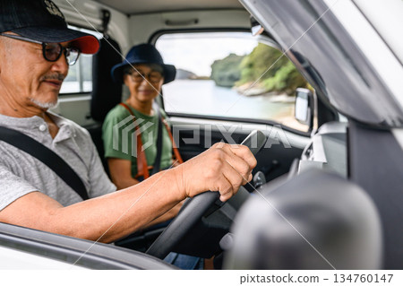 A couple travelling in a light truck [Photography cooperation: Oki Sea Sai A couple travelling in a light truck [Photography cooperation: Oki Sea Sai 134760147