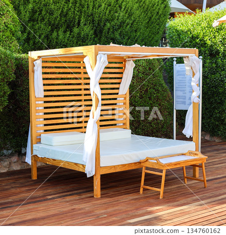 A place for relaxation and massage near the hotel pool 134760162