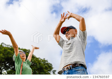 Elderly couple exercising outdoors [Photography cooperation: Oki Sea 134760597