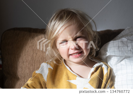 Girl Relaxing on Sofa and Fooling Around at Home on Weekend Girl Relaxing on Sofa and Fooling Around at Home on Weekend 134760772