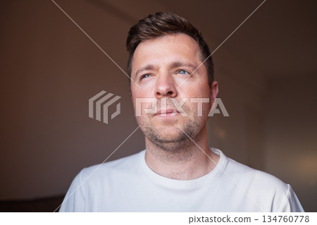 Young European Man Looking Aside Sadly 134760778