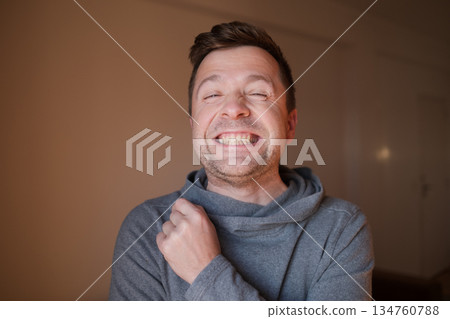 Middle Aged European Man with a Wide Fake Smile, Emotional Portrait 134760788