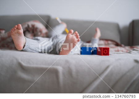 Little Toddler Fell Asleep on Sofa During Play Little Toddler Fell Asleep on Sofa During Play 134760793