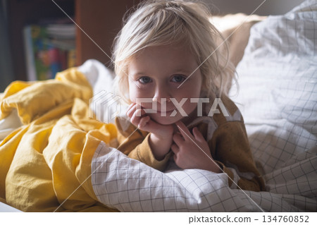 4 Year Old Blonde Girl Resting at Home Under a Blanket in Cold Weather 4 Year Old Blonde Girl Resting at Home Under a Blanket in Cold Weather 134760852