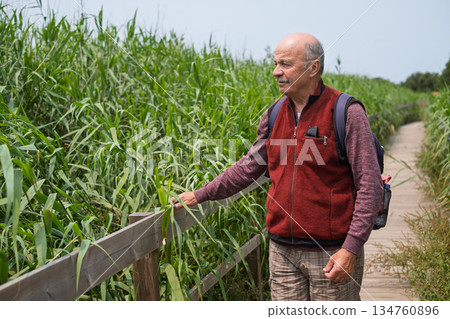 Elderly European Man Walking on an Eco-Trail in Portugal Elderly European Man Walking on an Eco-Trail in Portugal 134760896