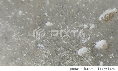 Close-up of a gray stone surface featuring white spots. The unique texture and pattern create an abstract background, ideal for design templates or creative projects. Close-up of a gray stone surface featuring white spots. The unique texture and pattern create an abstract background, ideal for design templates or creative projects. 134761320