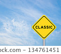 Yellow transportation sign with word classic on blue color sky background 134761451