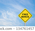 Yellow transportation sign with word free bonus on blue color sky background 134761457
