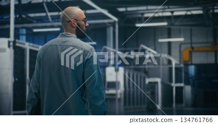 Engineer Inspecting Data Center Hall Engineer Inspecting Data Center Hall 134761766