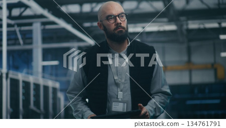 Specialist Checking Metrics On Personal Device 134761791