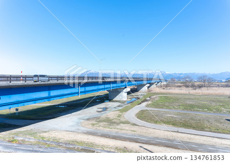Blue bridge and snowy mountains Blue bridge and snowy mountains 134761853
