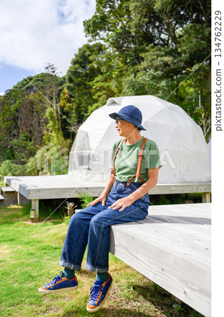 Elderly people taking a rest at a glamping camp [Photography cooperation: Oki Seaside Resort Miyabi] 134762229