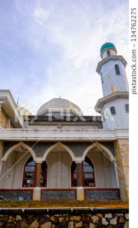 Arched Veranda of a Mosque with Wooden Pillars and Stone Base Arched Veranda of a Mosque with Wooden Pillars and Stone Base 134762275