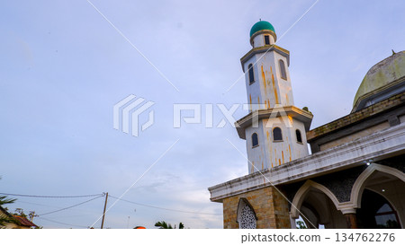 Tall Minaret of a Mosque Against a Clear Sky Backdrop 134762276
