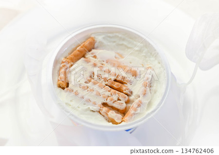 Making a cake using biscuits in Greek yogurt Making a cake using biscuits in Greek yogurt 134762406