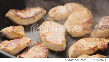turkey fillet pieces frying on nonstick pan turkey fillet pieces frying on nonstick pan 134762821