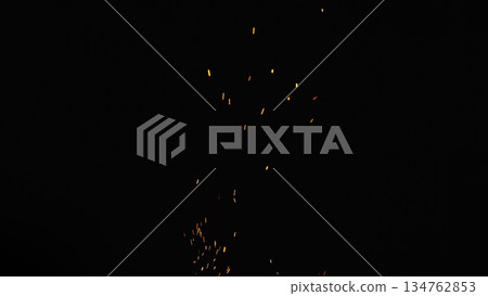 sparks and embers from campfire flying over black background sparks and embers from campfire flying over black background 134762853
