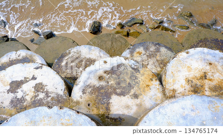 Top View of Concrete Breakwater Blocks on Shore Top View of Concrete Breakwater Blocks on Shore 134765174