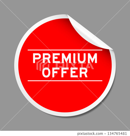 Red color peel sticker label with word premium offer on gray background Red color peel sticker label with word premium offer on gray background 134765481