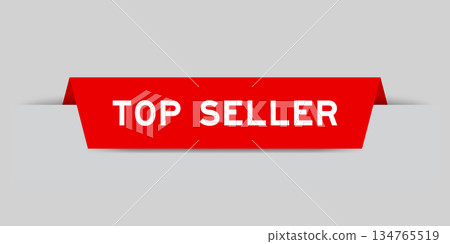 Red color inserted label with word top seller on gray background 134765519