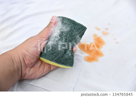 hand hold bubble with cleaning soap for clean dirty stain on shirt fabric hand hold bubble with cleaning soap for clean dirty stain on shirt fabric 134765845