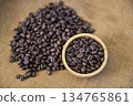 Medium roasted coffee beans in bowl from fresh roast in home cafe 134765861